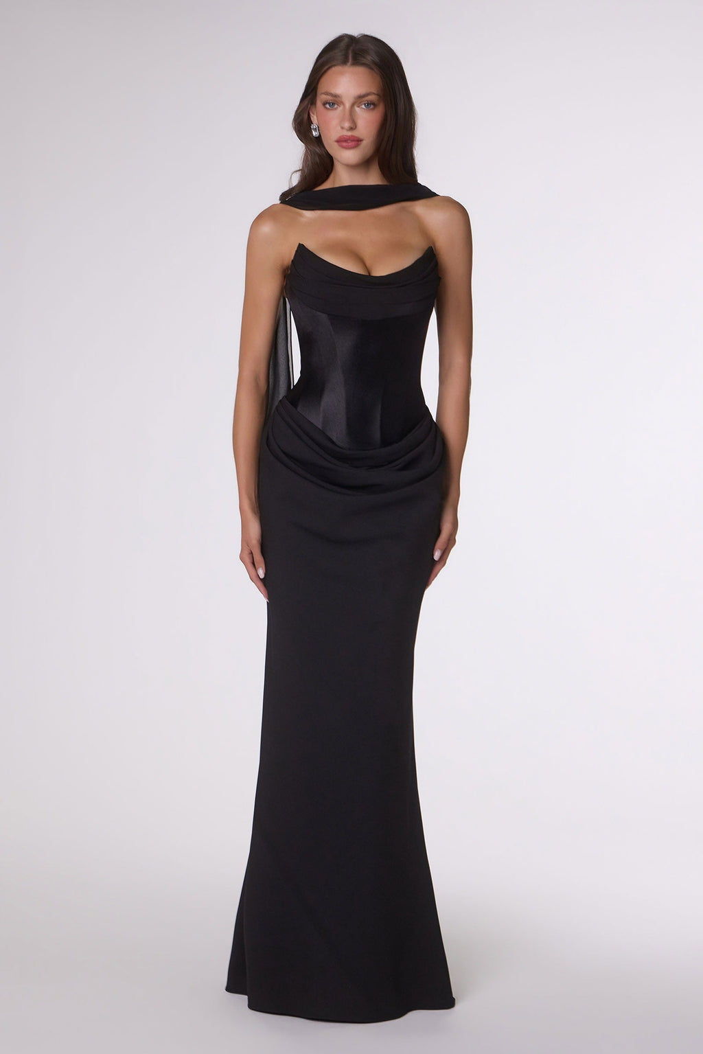Strapless fitted column gown in black with cowl neckline and draped side