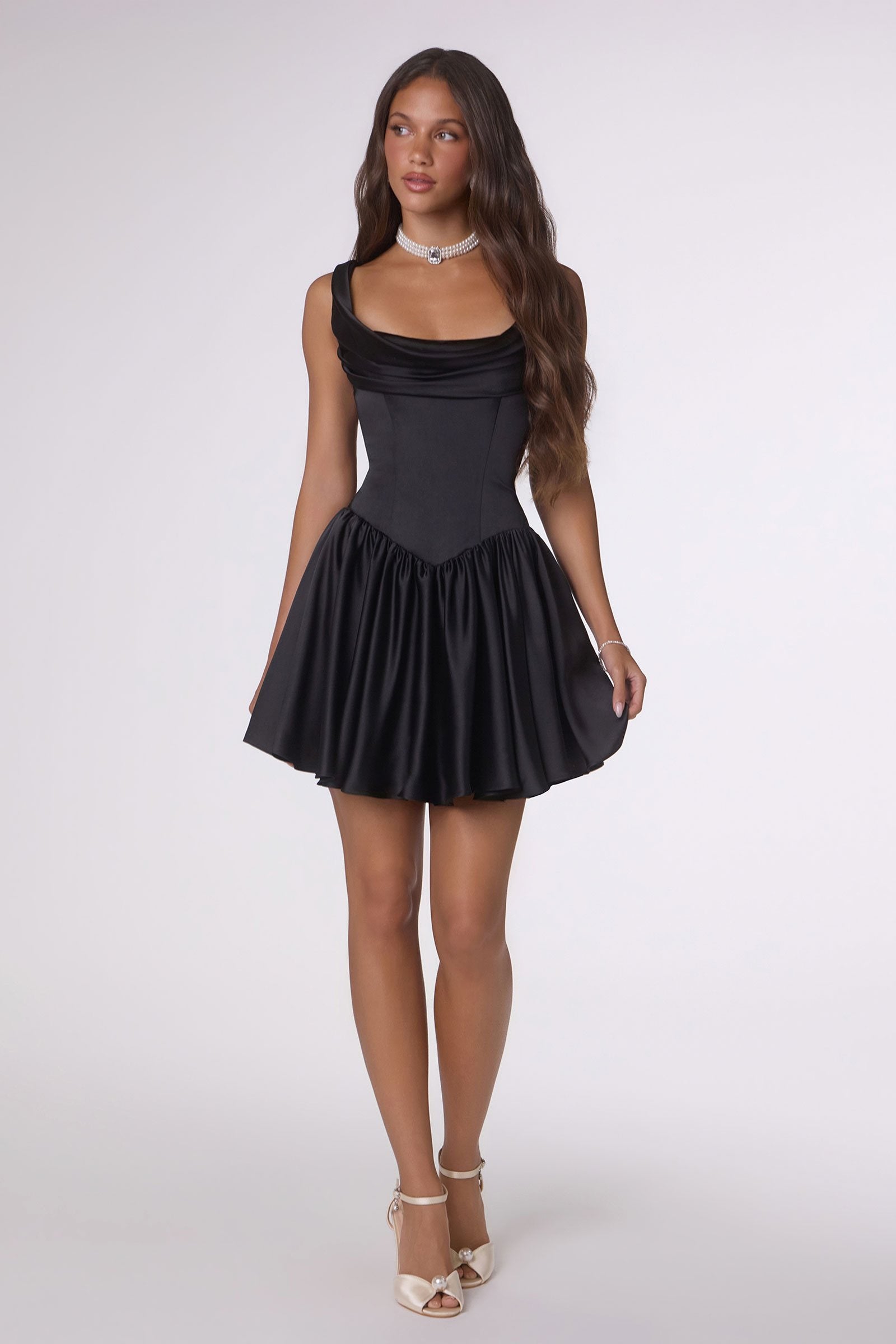 Black satin flared mini dress with ruched waist and flared pleated skater hem