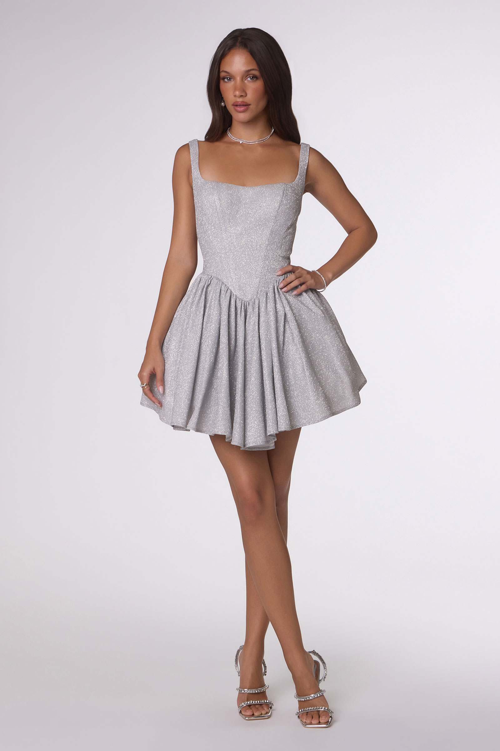 Silver-gray sleeveless mini dress with fitted bodice and tiered ruffle skirt