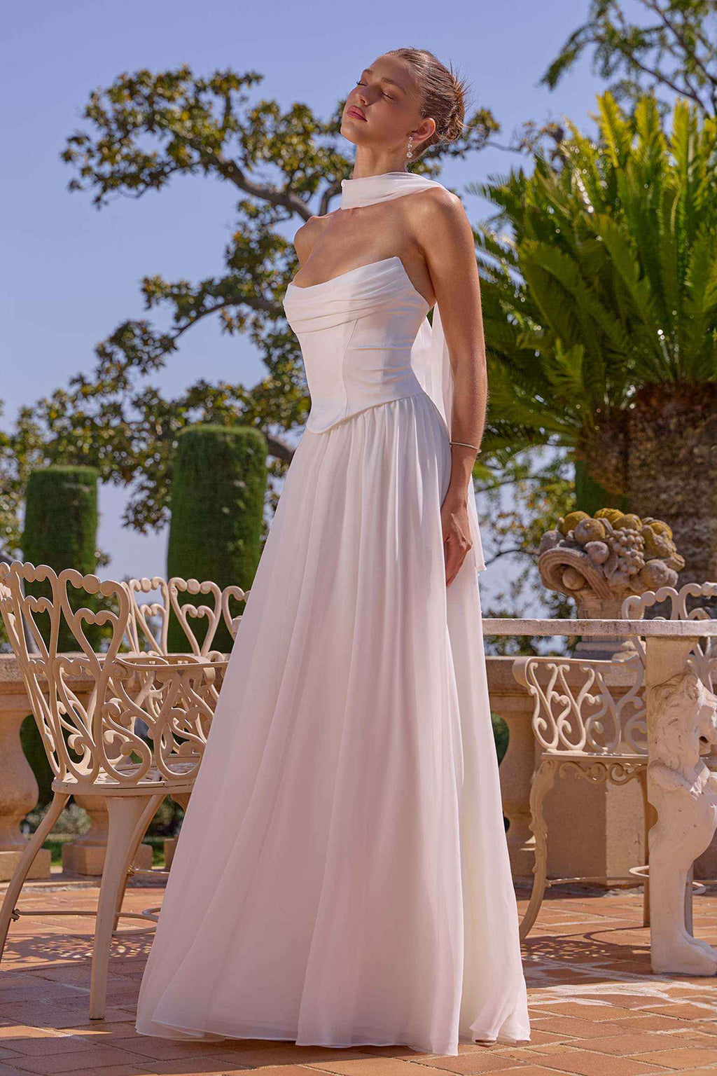 Off-white strapless chiffon A-line evening gown with empire waist and long skirt