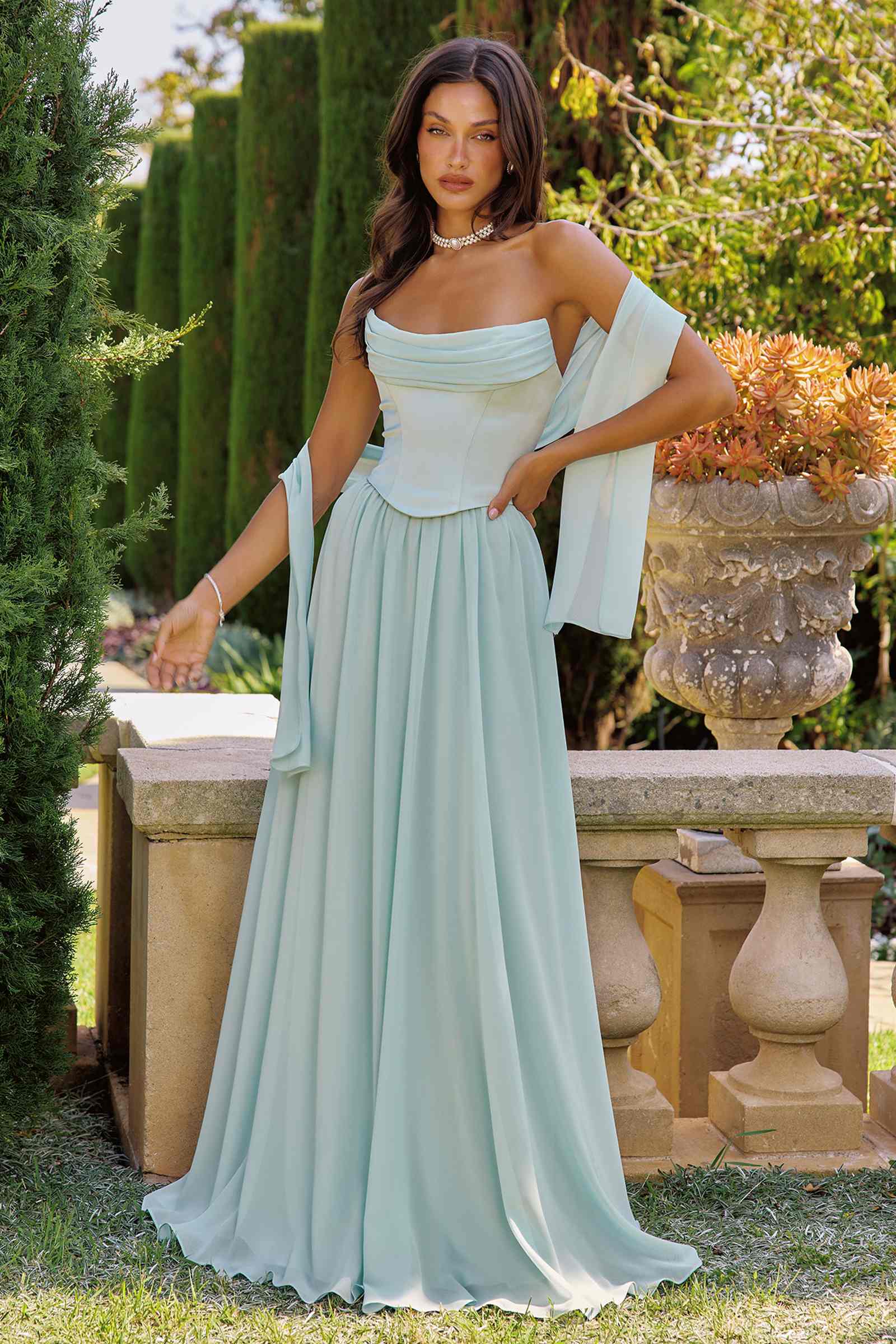 Chiffon A-line strapless evening gown in light blue with flowing skirt and side drape