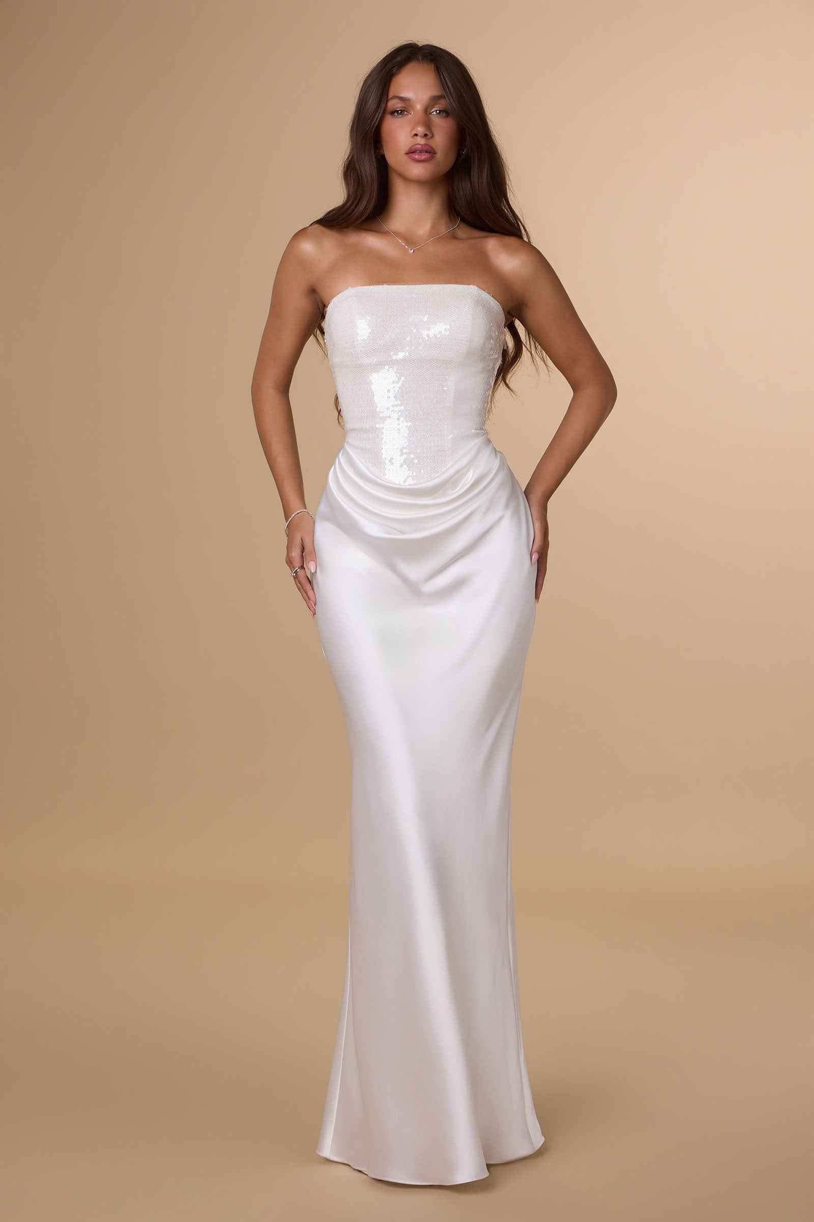 Off-white strapless sequin bodice satin column dress with gathered waist drape