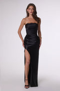 Black strapless satin formal gown with high slit and ruched fitted silhouette