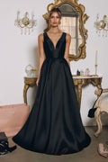 Satin A-line V-neck dress in black with sleeveless bodice, fitted waist, and long skirt