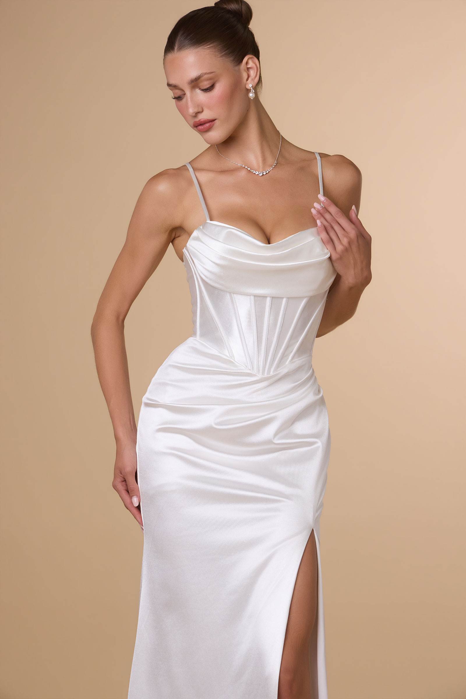 Off-white satin bustier dress with spaghetti straps, ruched bodice and slit