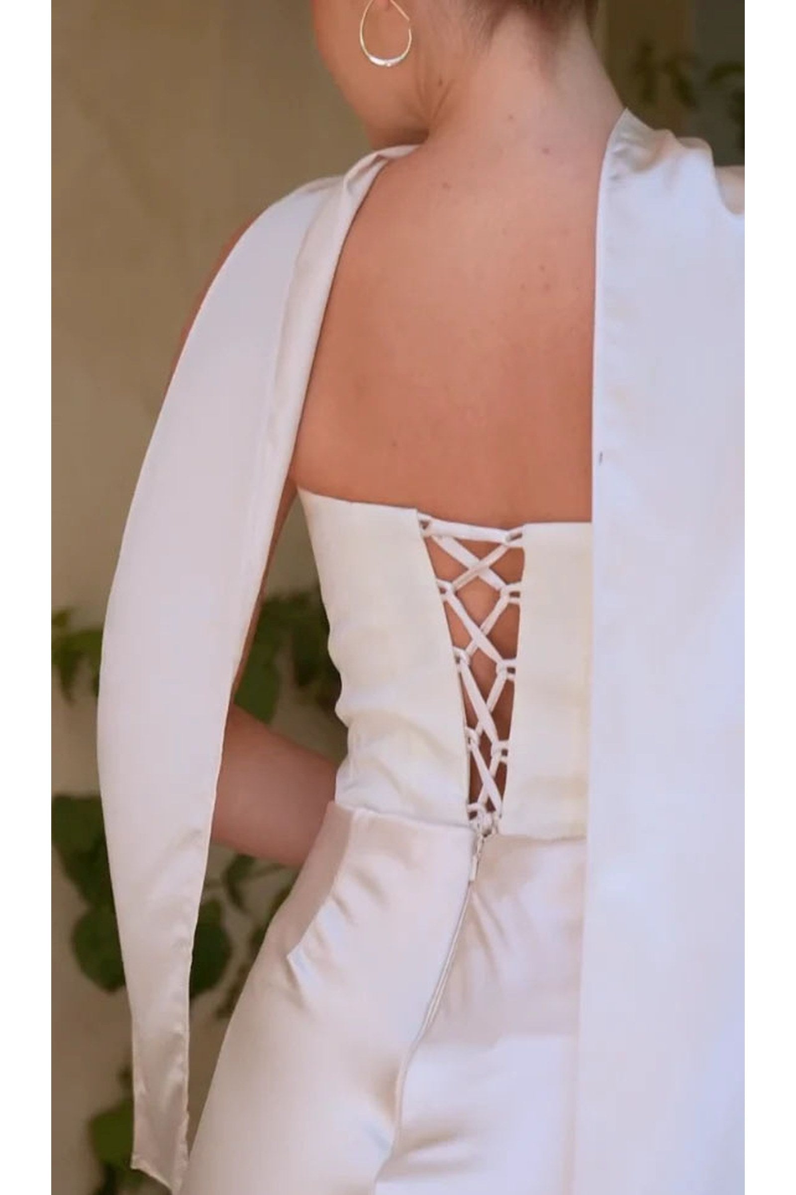 Off-white satin back bodice with lace-up crisscross panel and flowing drape shoulder