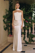 Off-white strapless satin column dress with draped waist detail and floor-length skirt