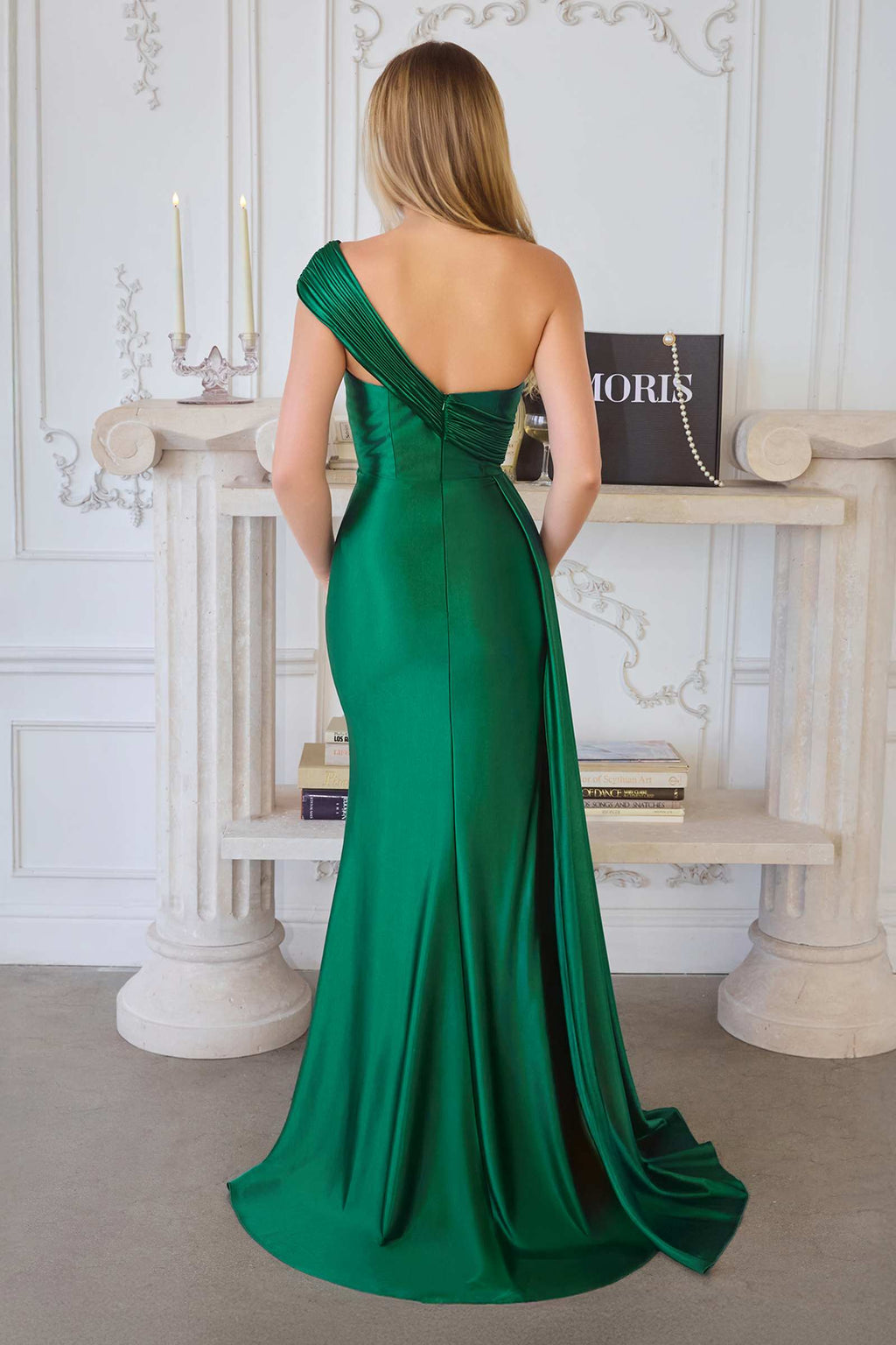 Emerald green fitted evening dress with draped one-shoulder strap and back slit