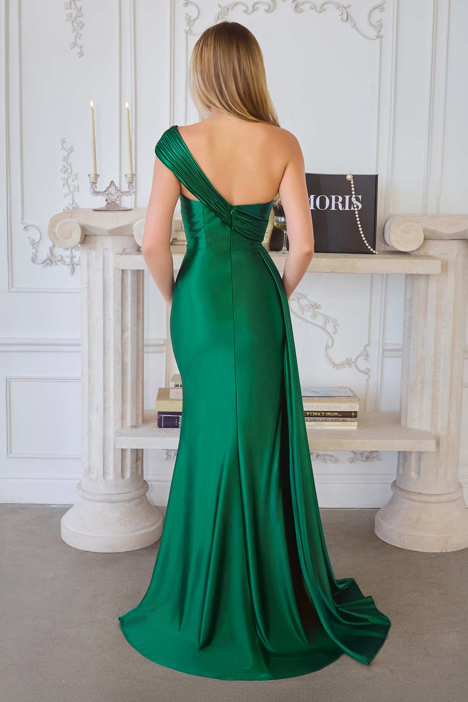 Emerald green fitted evening dress with draped one-shoulder strap and back slit