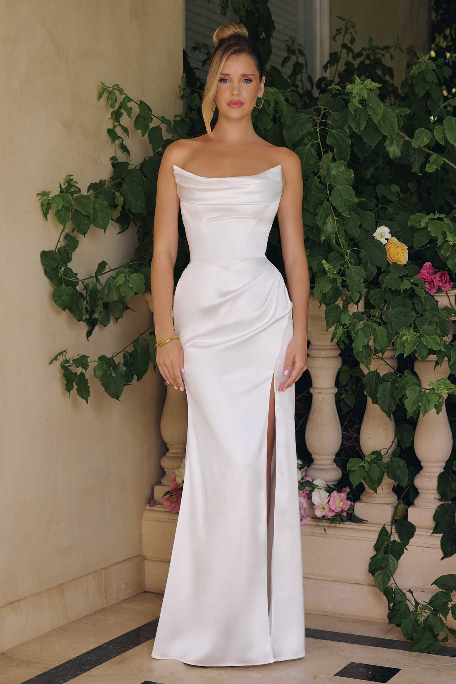 Off-white satin bridal gown, off-shoulder neckline, fitted waist, side slit, floor length