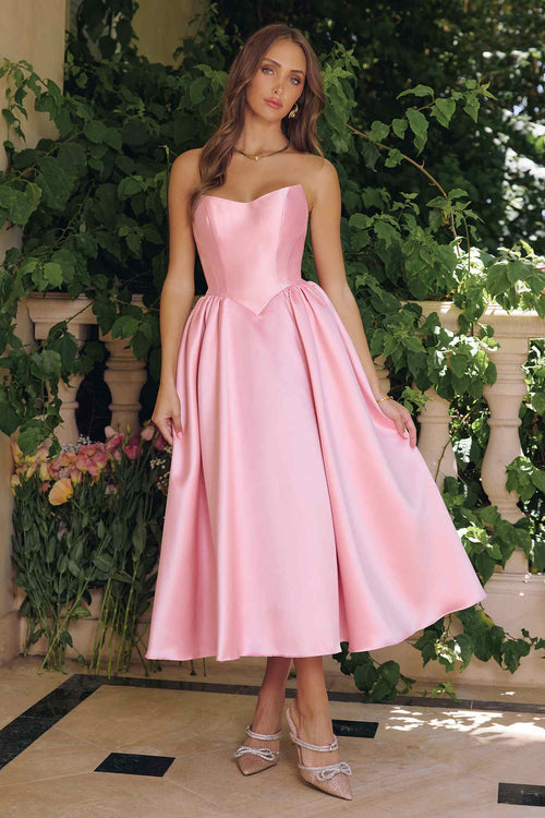 Pink strapless midi gown with fitted bodice and flared, gathered skirt