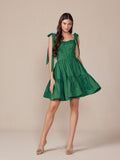 Green A-line dress with bow shoulder ties and tiered skirt