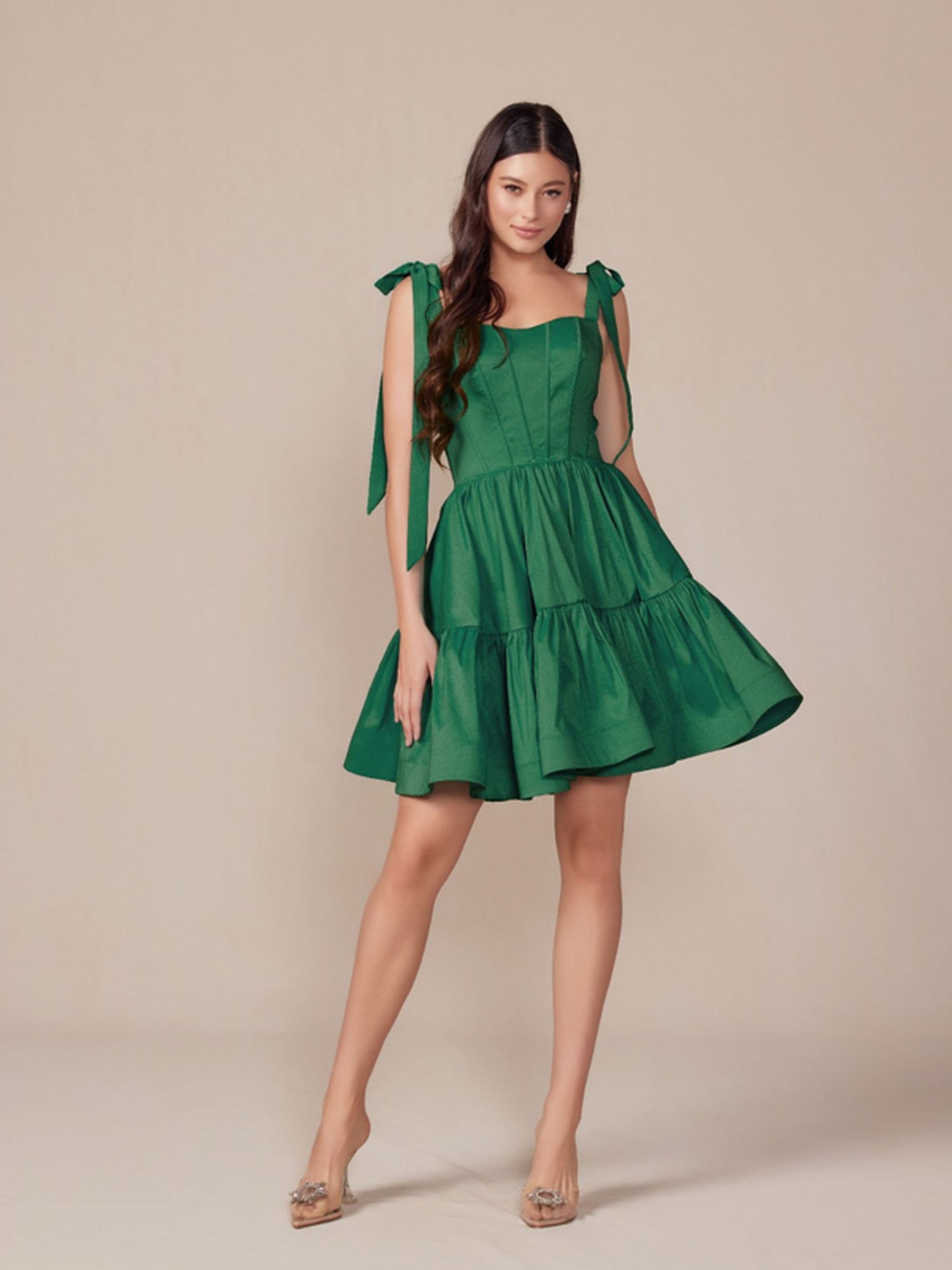 Green A-line dress with bow shoulder ties and tiered skirt