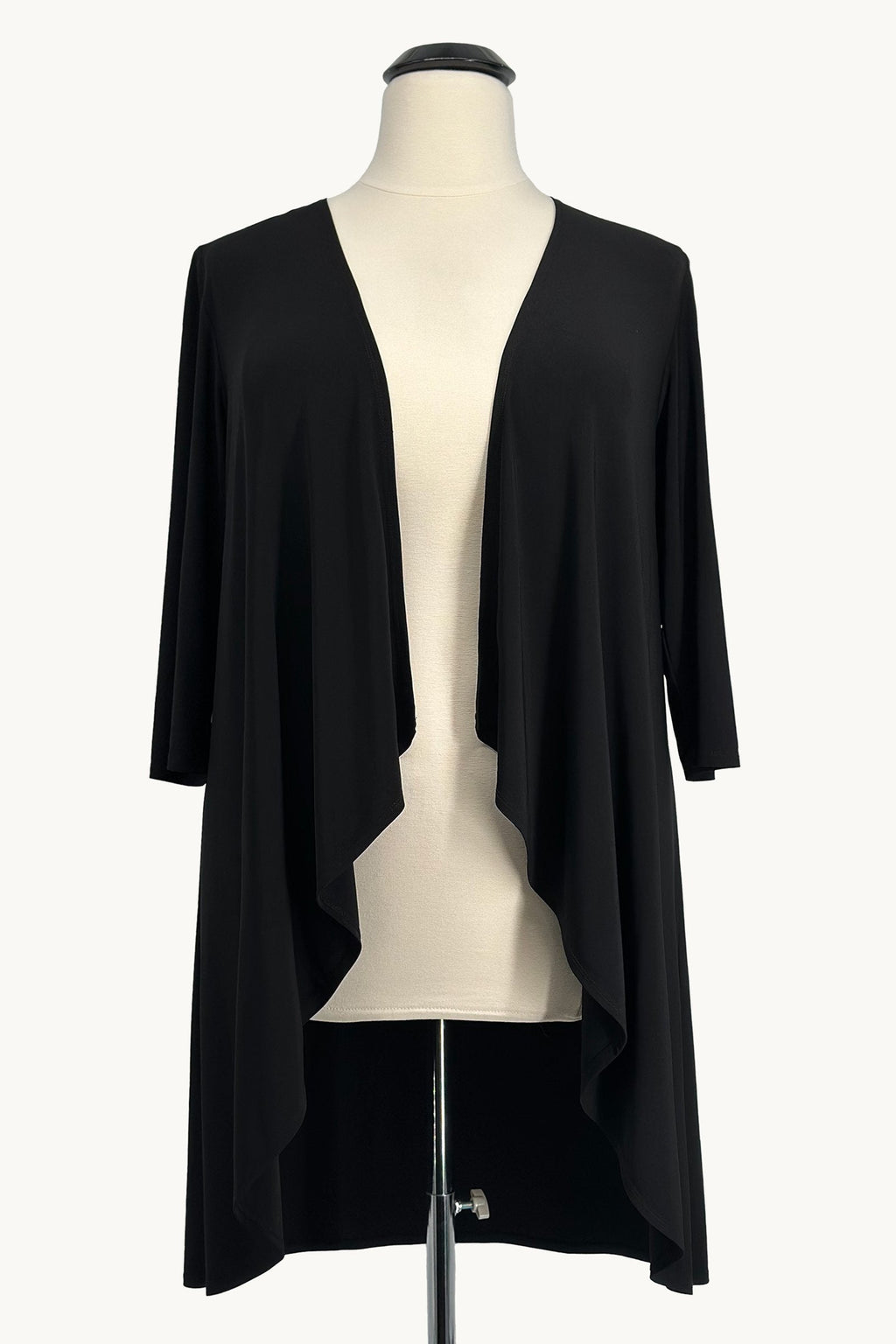 Black evening gown with draped shawl overlay, open front detail, and fitted skirt