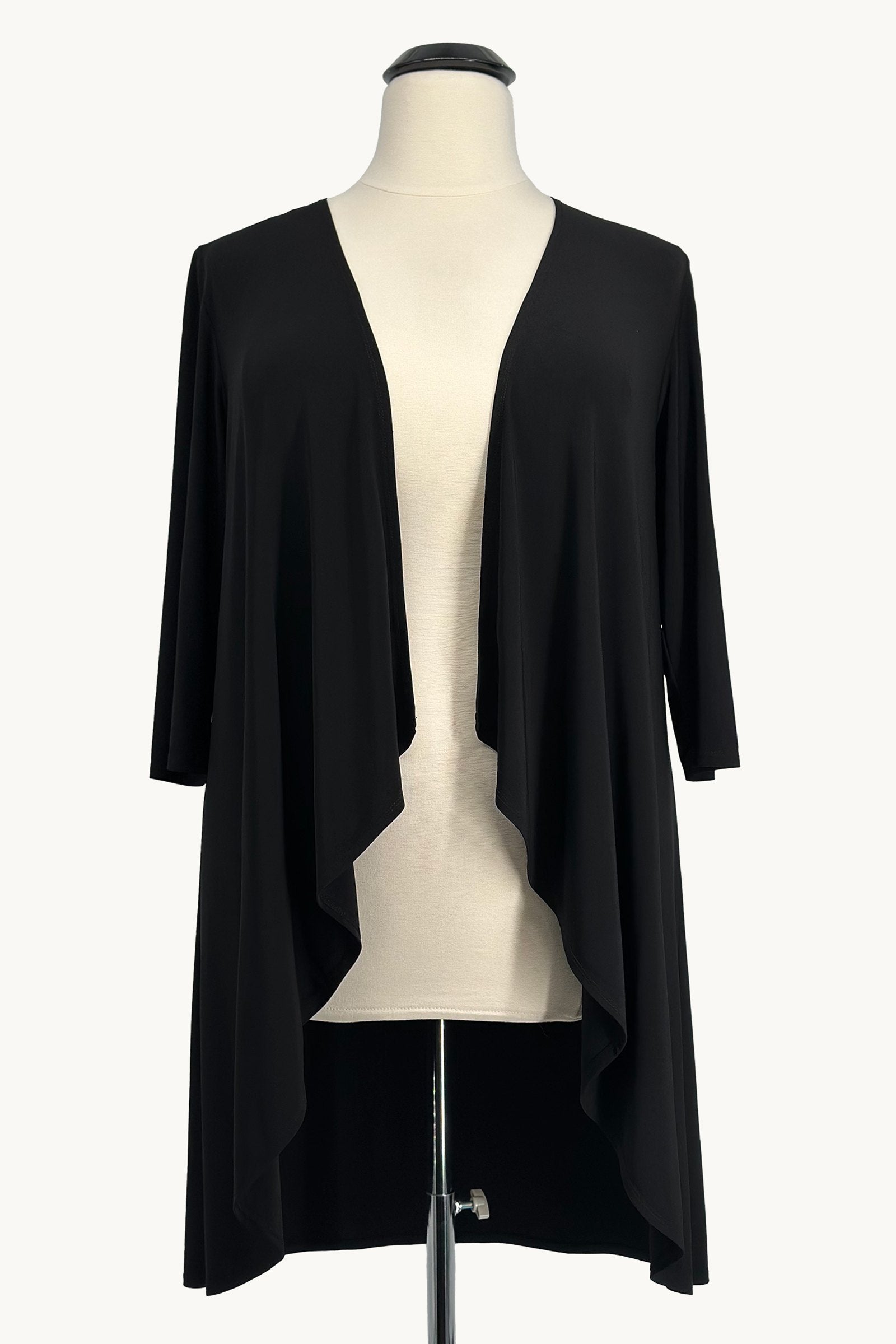 Black evening gown with draped shawl overlay, open front detail, and fitted skirt