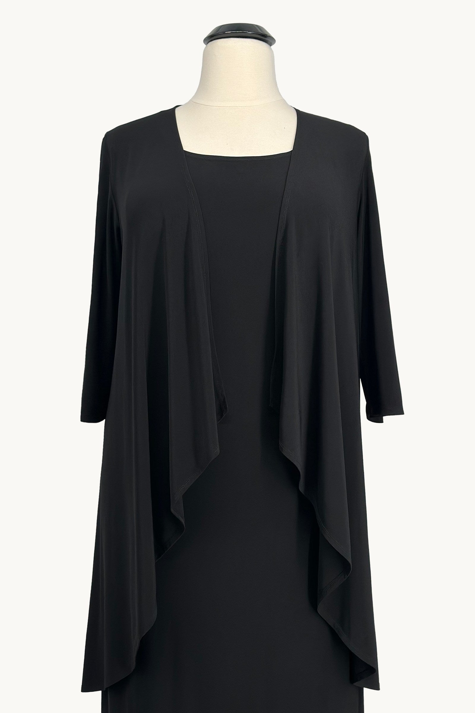 Black evening gown with draped overlay and three-quarter sleeves; open front look