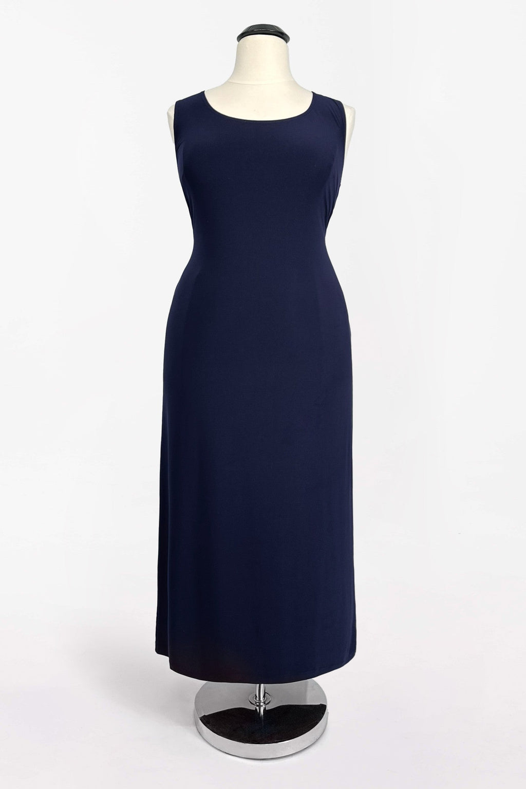 Navy sleeveless evening dress with fitted bodice and straight skirt; layered overlay
