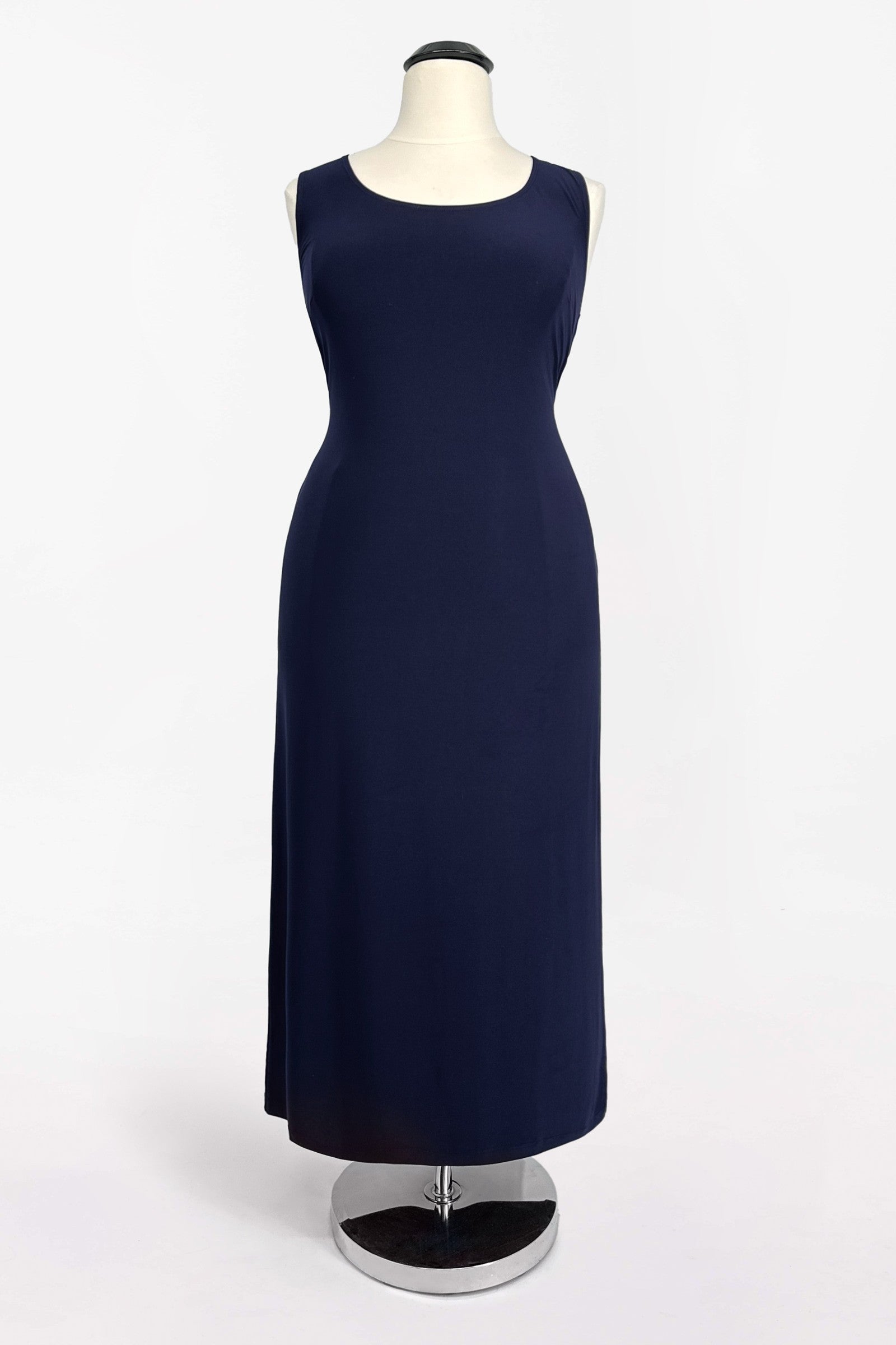 Navy sleeveless evening dress with fitted bodice and straight skirt; layered overlay