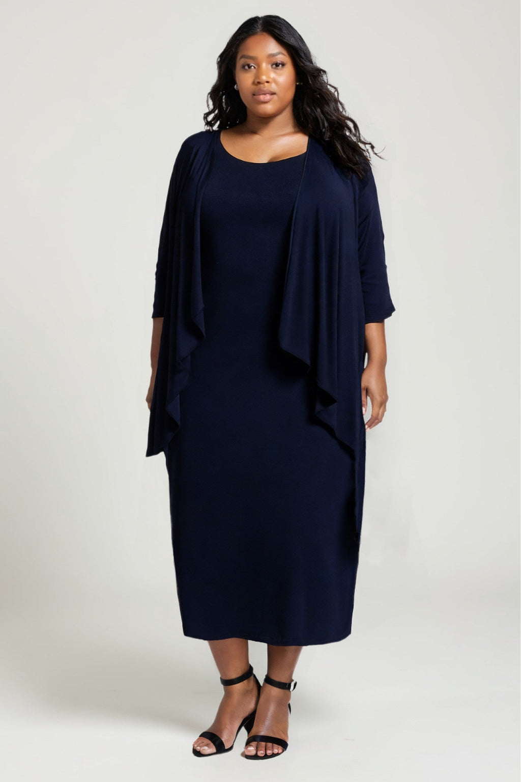 Navy blue semi-formal gown set with draped cape overlay and fitted midi dress