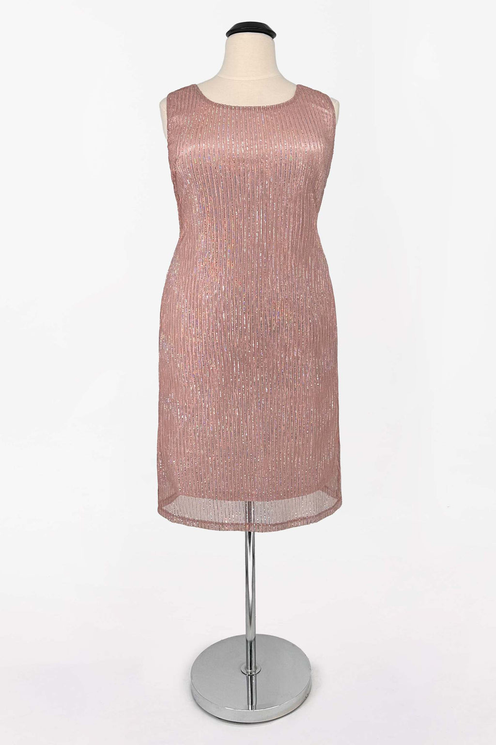 Rose gold sequin sleeveless evening dress with sheer hem overlay on dress form