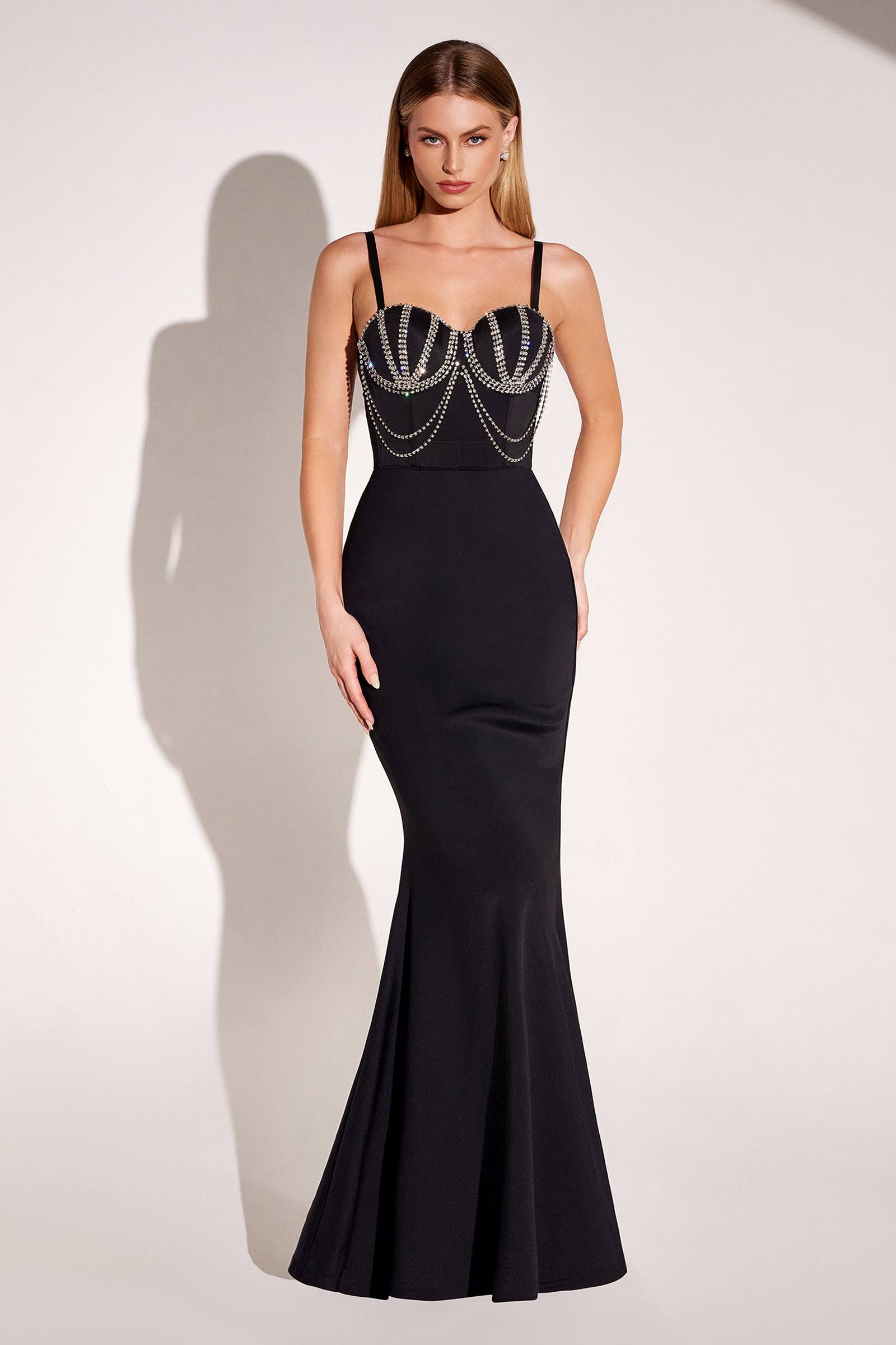 Black fitted evening gown with sweetheart neckline, beaded bust, thin straps, mermaid hem