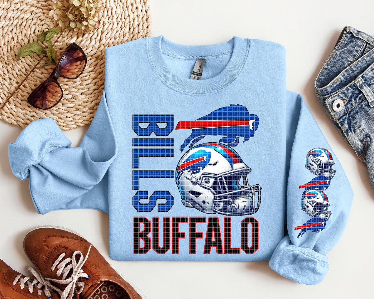 Light blue graphic tee with 'Bills' text and football helmet graphic, crew neck