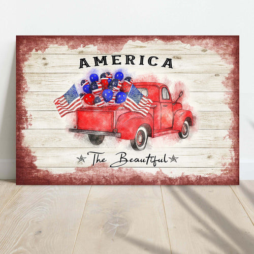 Patriotic canvas wall art with red truck, blue balloon display, and 'The Beautiful' text
