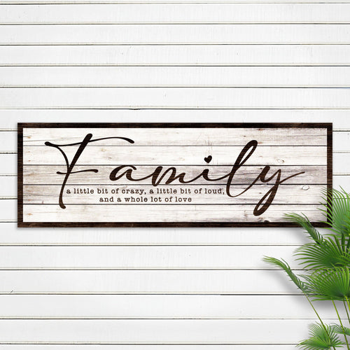 Framed family sign in white woodgrain with large cursive 'Family' and small love quote