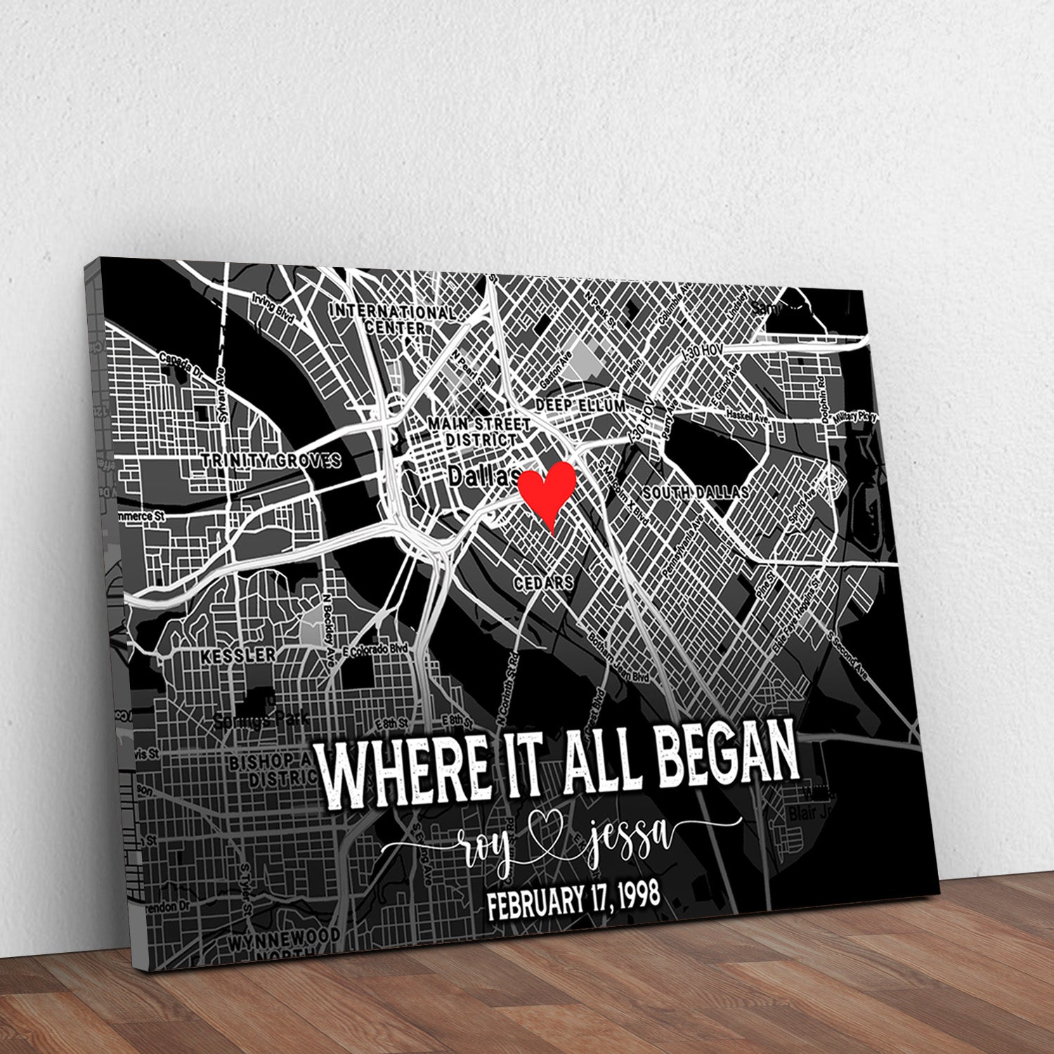 Black street map canvas with red heart pin and 'Where it all began' lettering