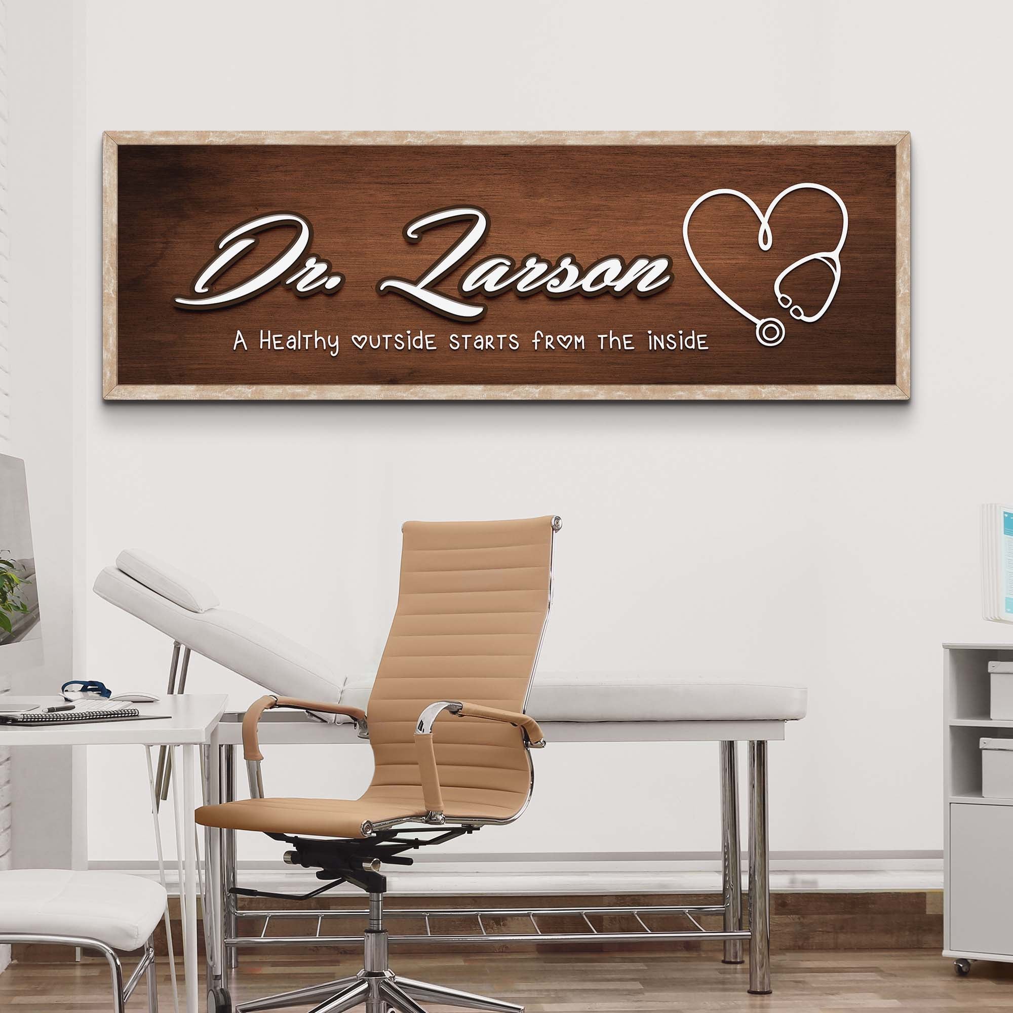 Framed doctor name wall sign with Dr. Larson script and heart-stethoscope icon