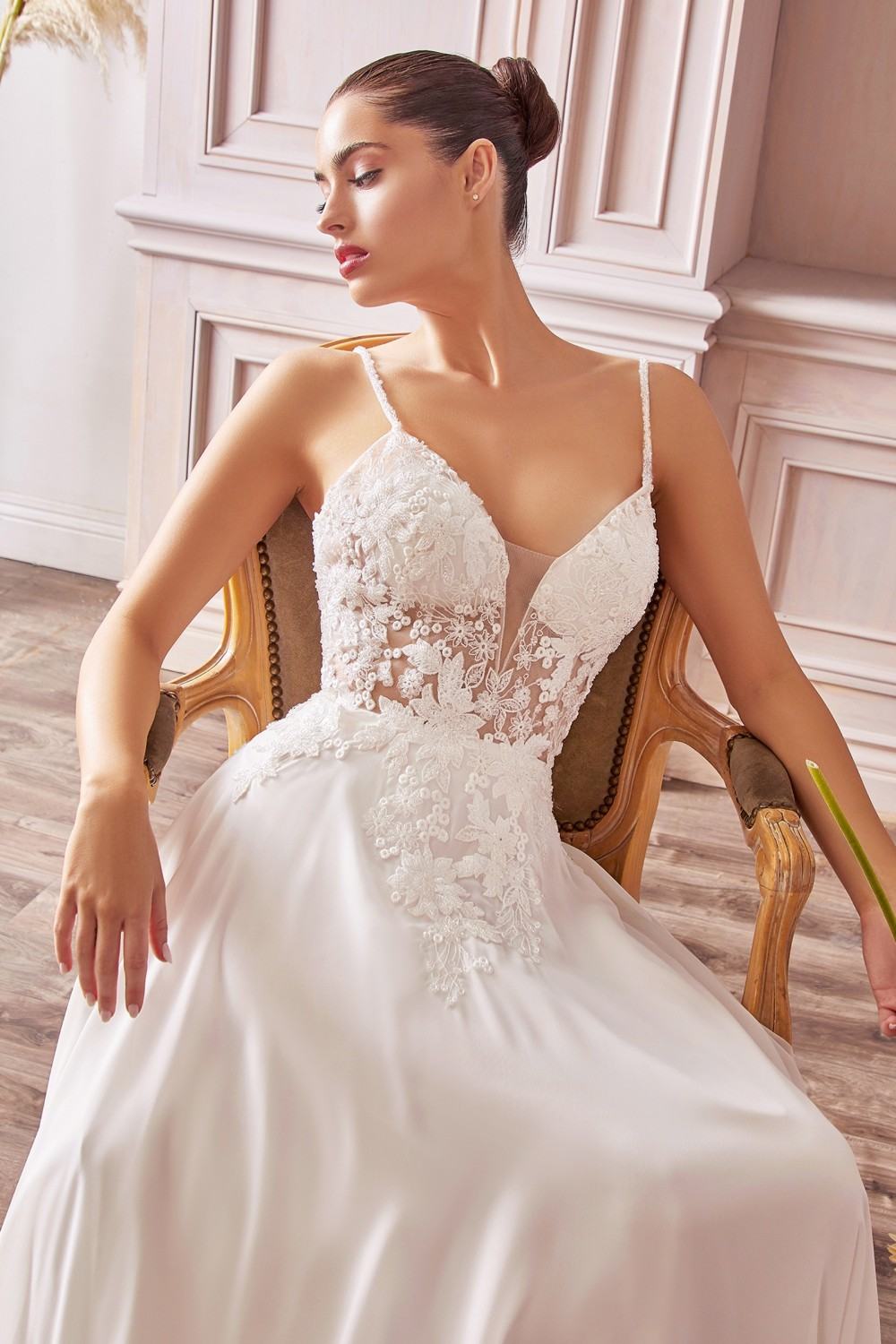 Off-white A-line chiffon gown with beaded floral appliqué bodice and spaghetti straps