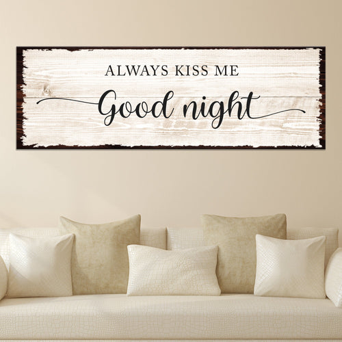 Framed wall sign: “Always Kiss Me” and “Good night” on whitewashed woodgrain