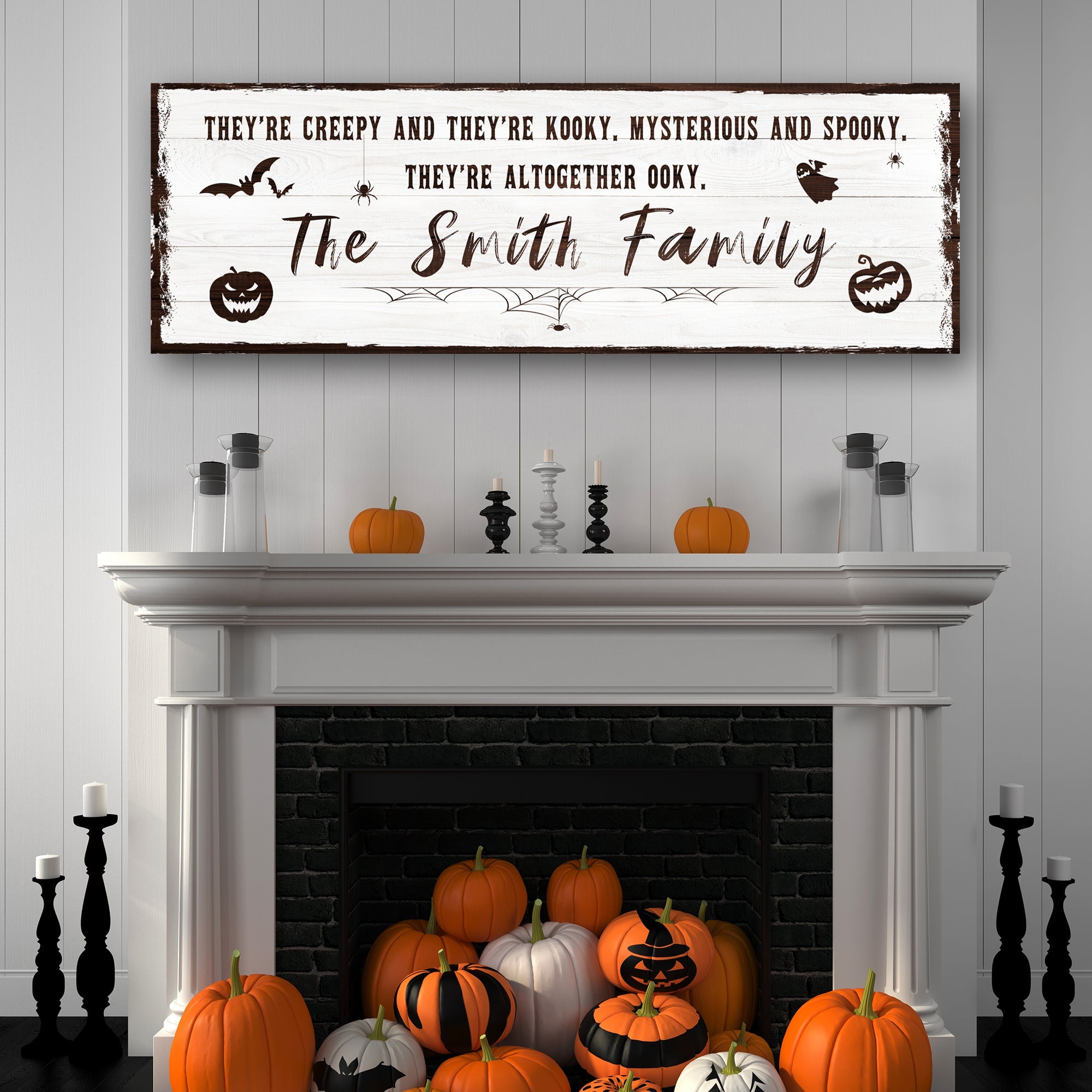 Halloween family sign over fireplace, black banner with gold 'The Smith Family' script