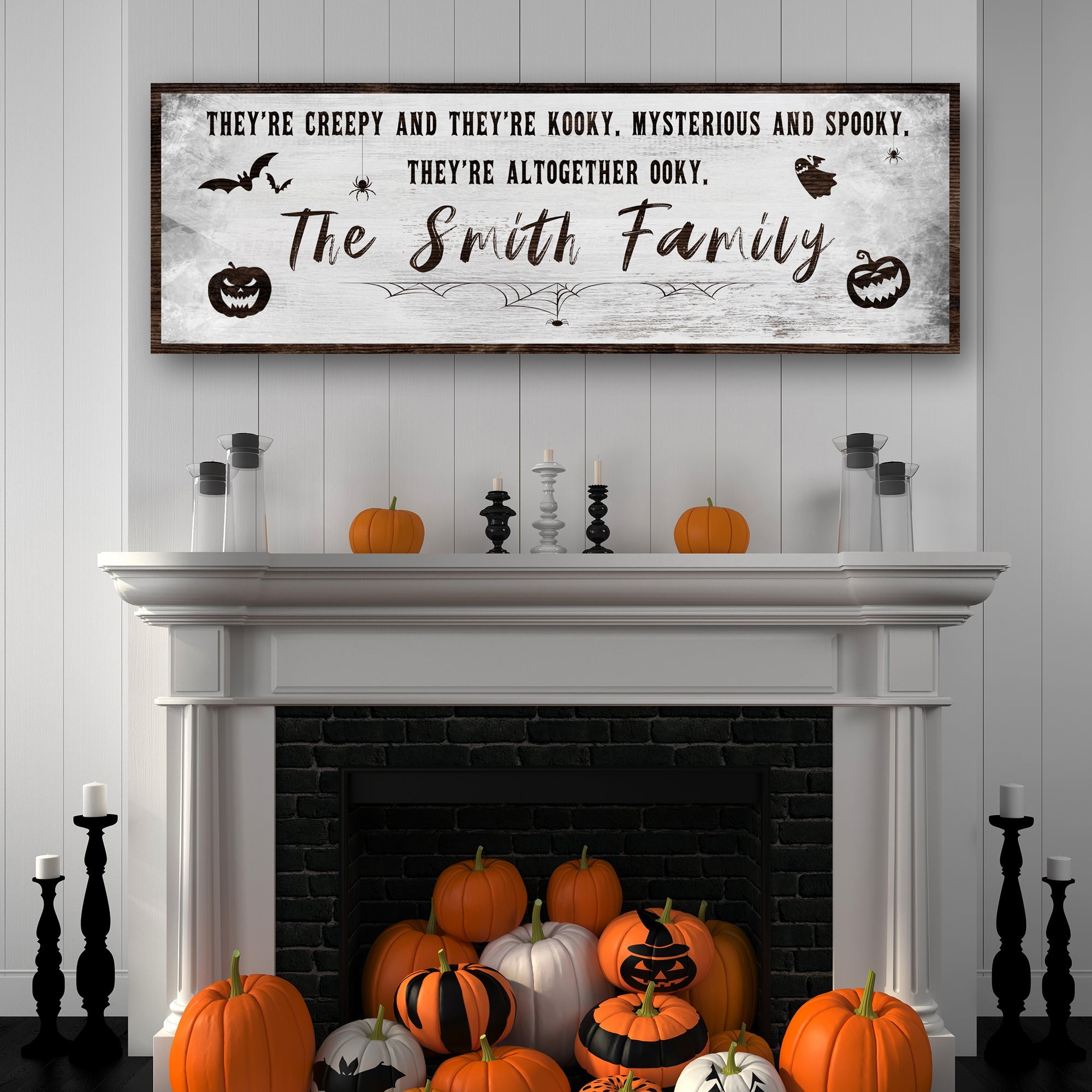 Halloween family sign over fireplace, black speckled banner with gold 'The Smith Family' text