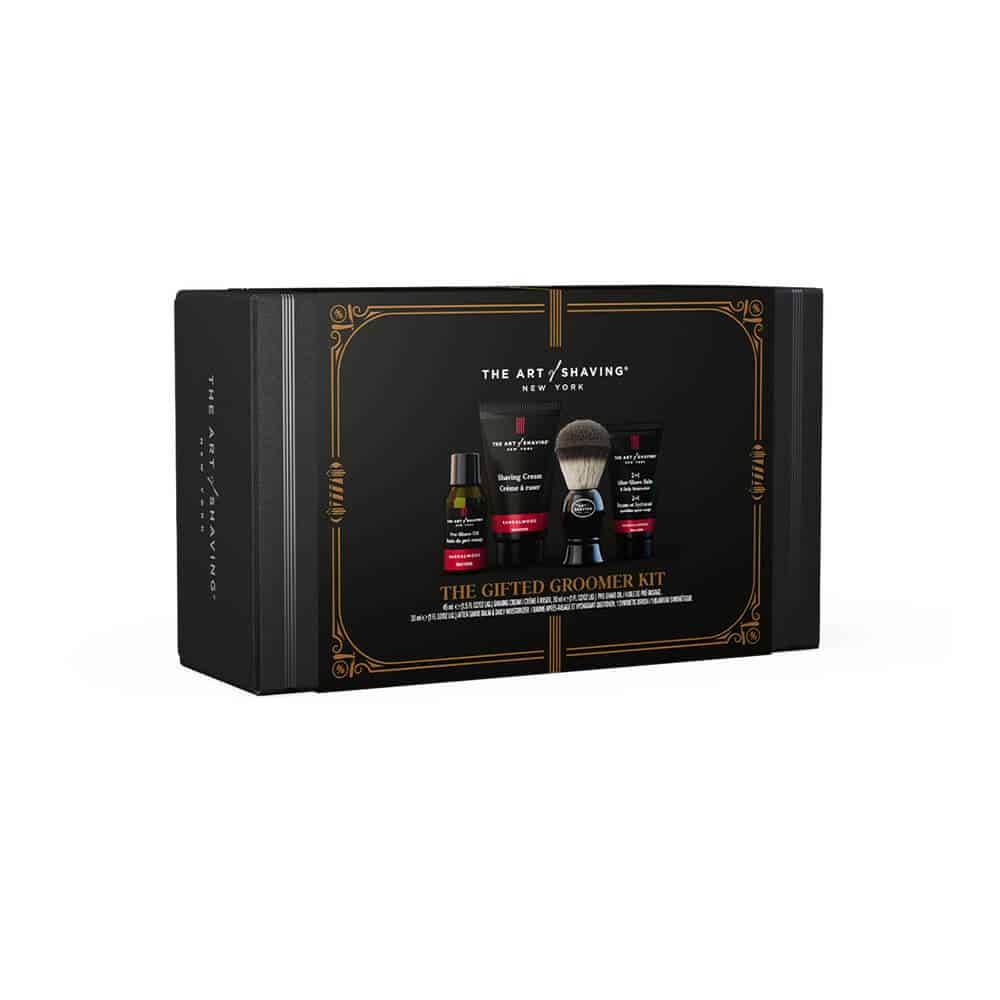 Groomer kit gift box with sandalwood-themed shaving products, dark and gold design