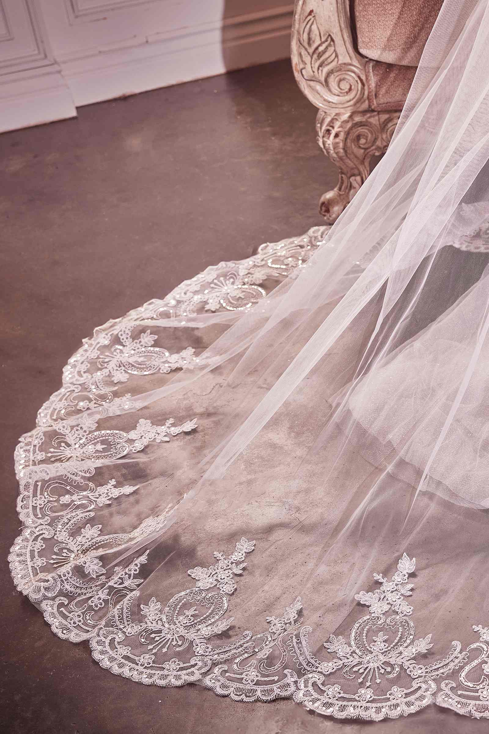 Off-white chapel veil with detailed floral lace edge and scalloped embroidery trim