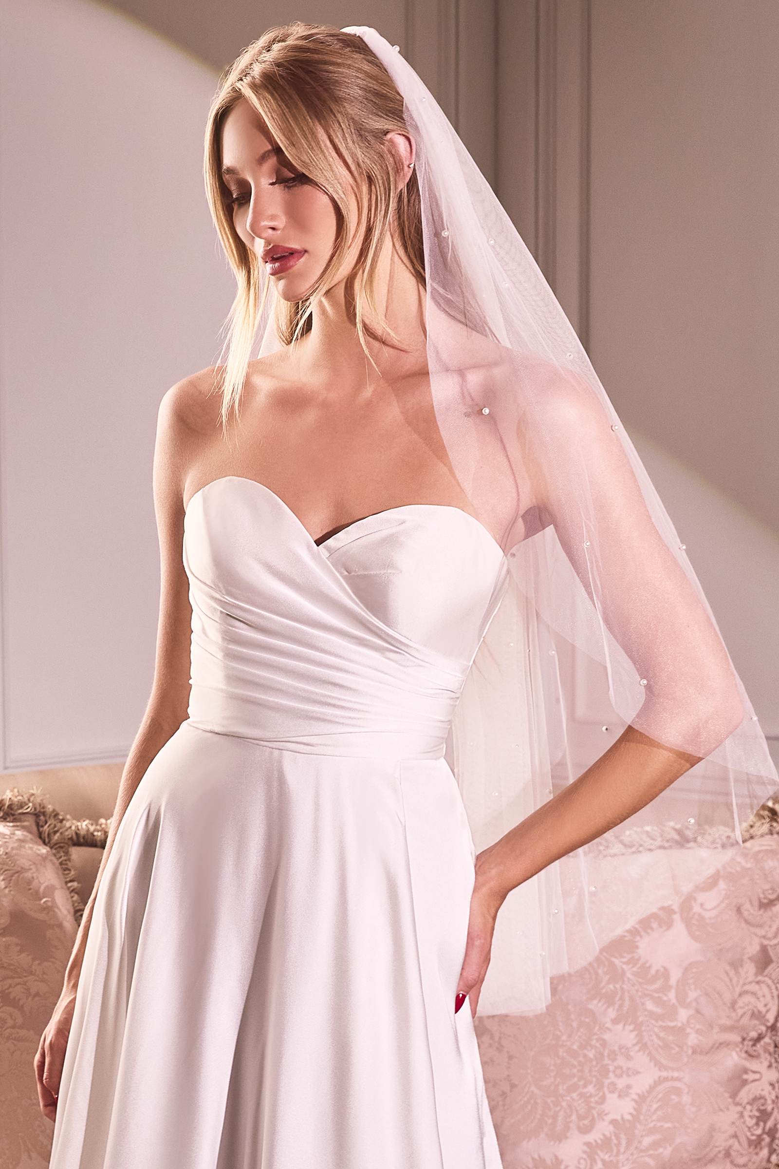 Off-white fingertip bridal veil with pearl beaded drop details