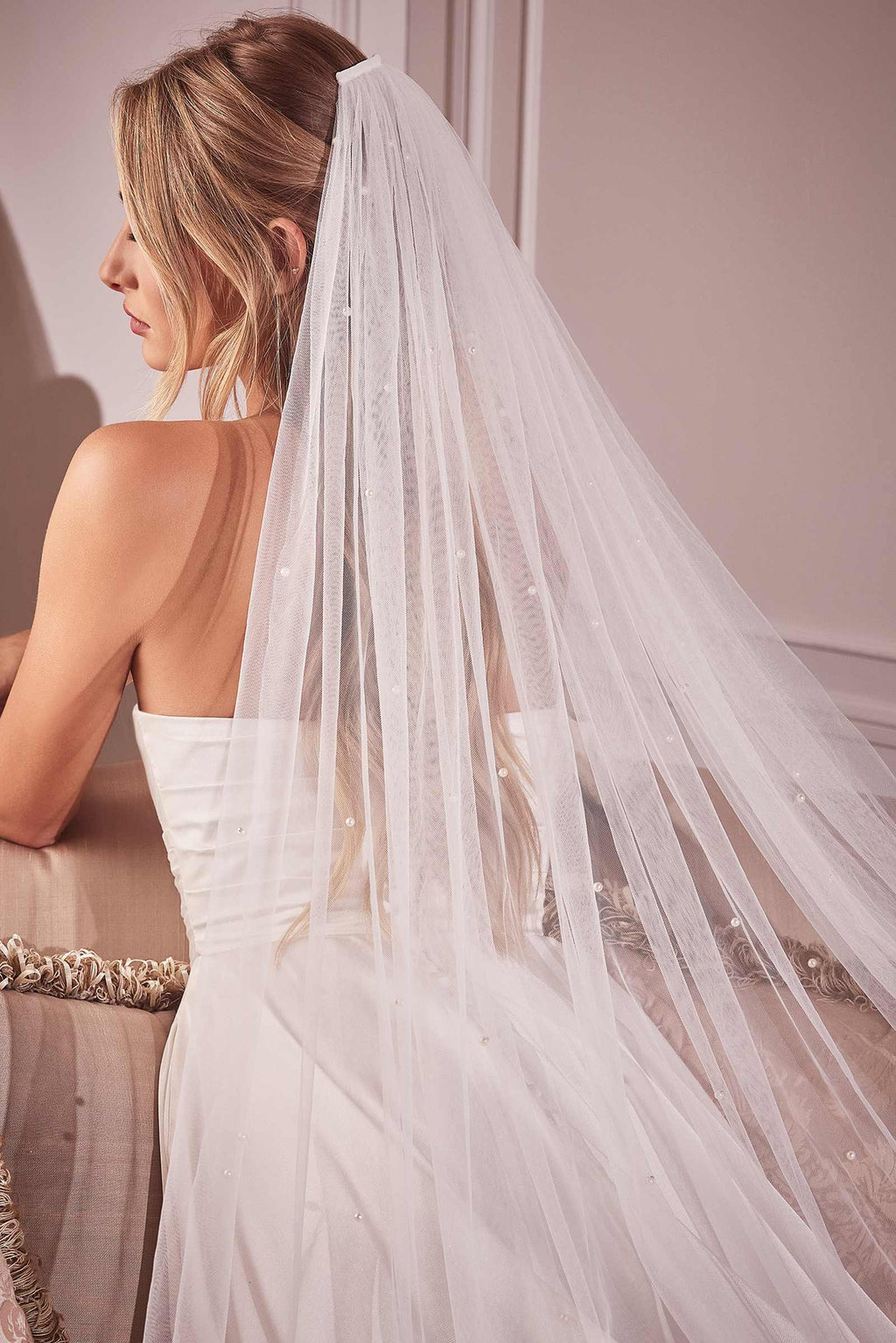 Off-white tulle chapel veil, layered net with pearl-like dots along edge