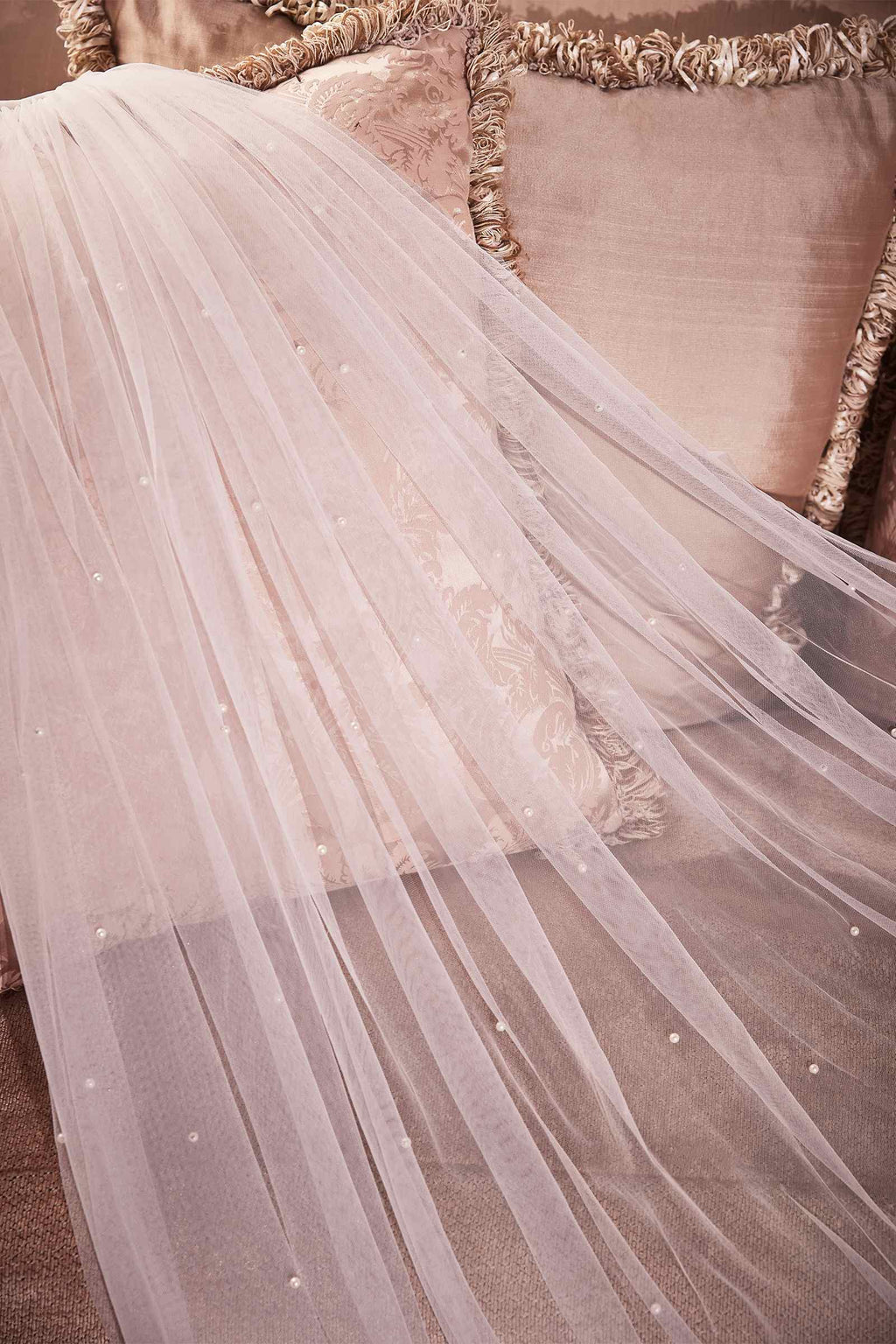 Off-white layered tulle veil with subtle pearl speckles