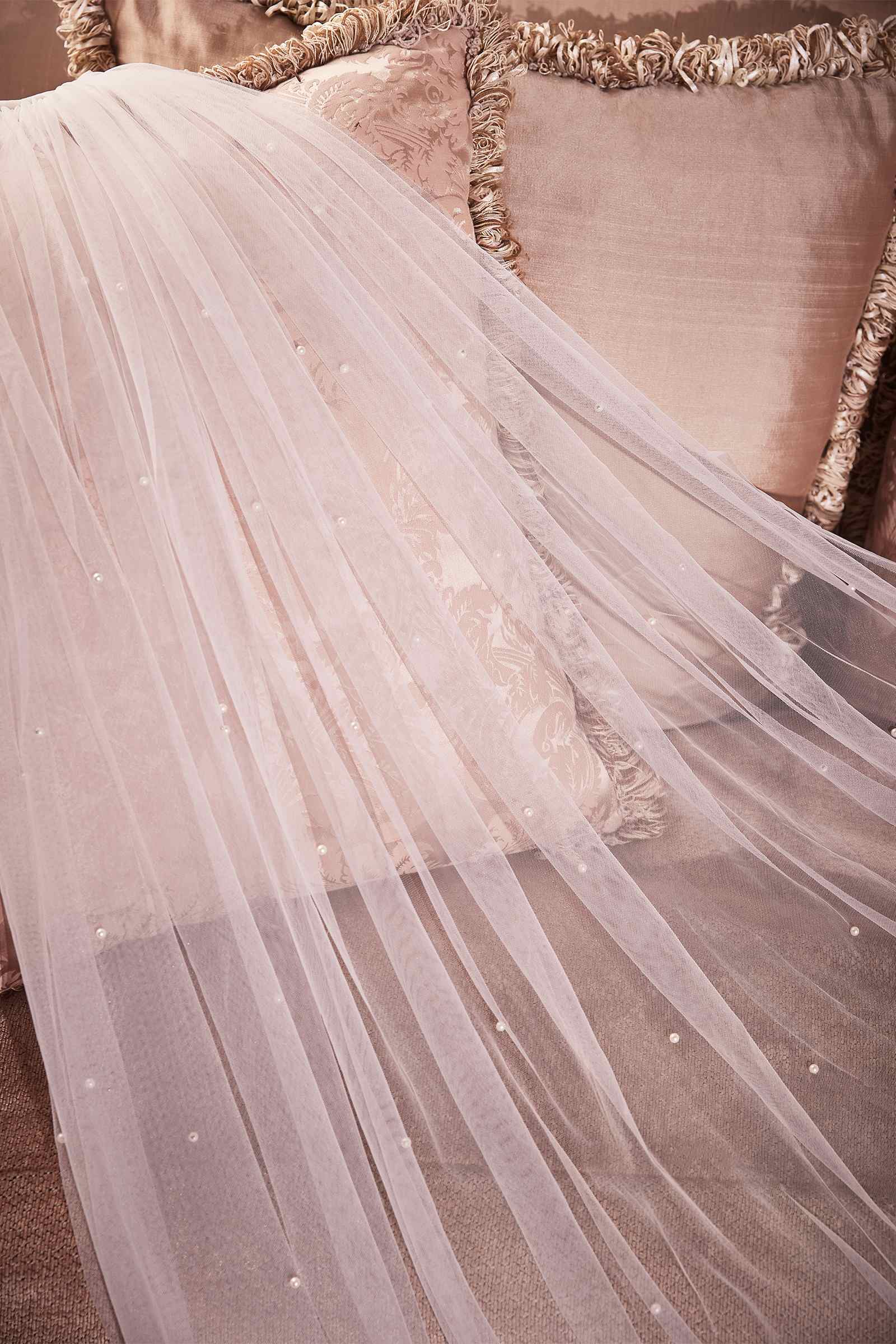 Off-white layered tulle veil with subtle pearl speckles