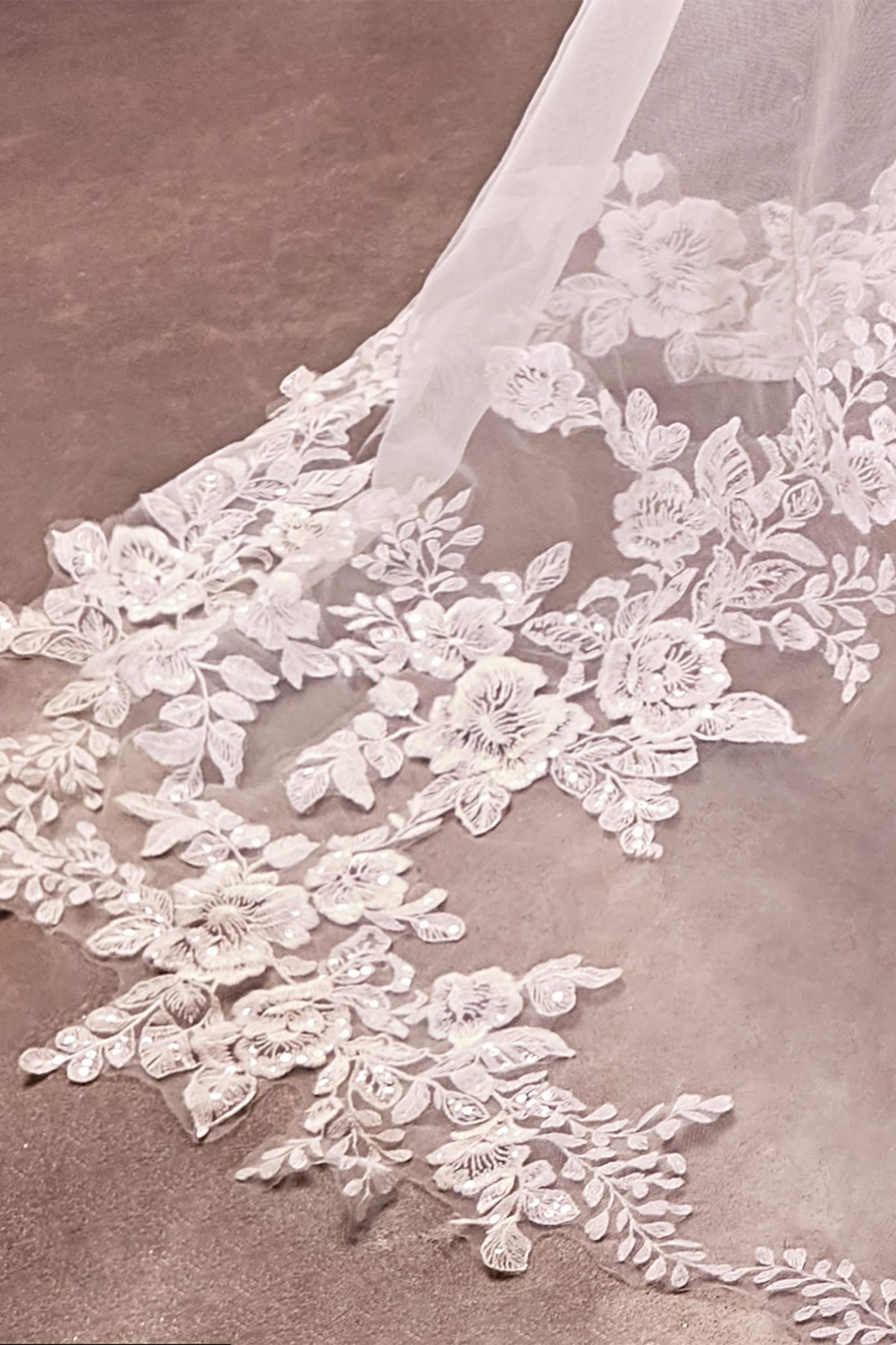 Off-white floral applique border on sheer royal veil edge