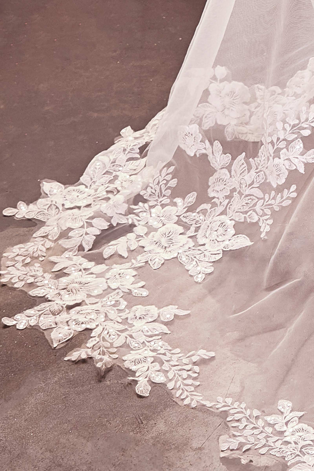 Off-white royal veil with floral lace border and scalloped hem