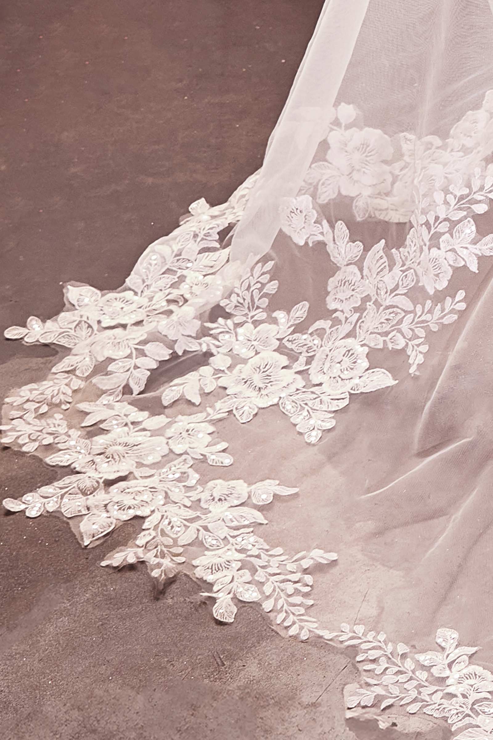 Off-white royal veil with floral lace border and scalloped hem