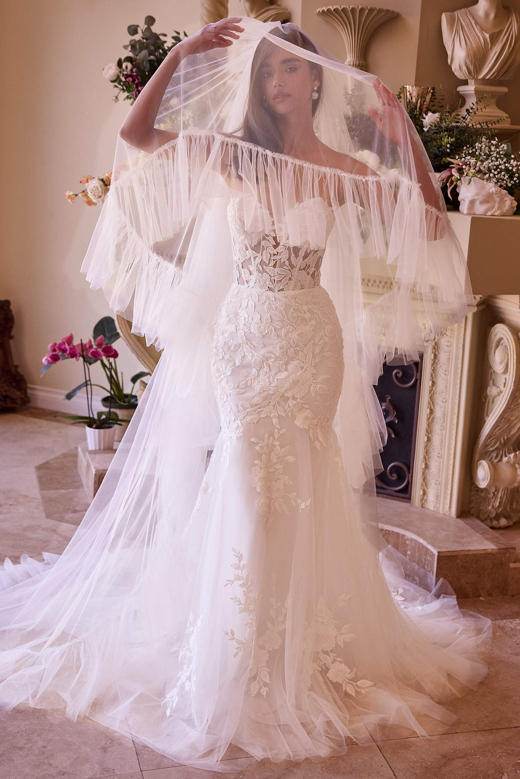 Off-white two-tier bridal veil with ruffled edge, draped over shoulders