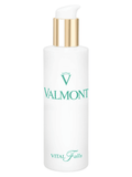 White skincare bottle with gold pump and teal Valmont logo
