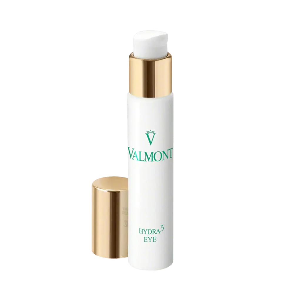 Eye cream bottle with gold cap; includes smaller companion tube, white body