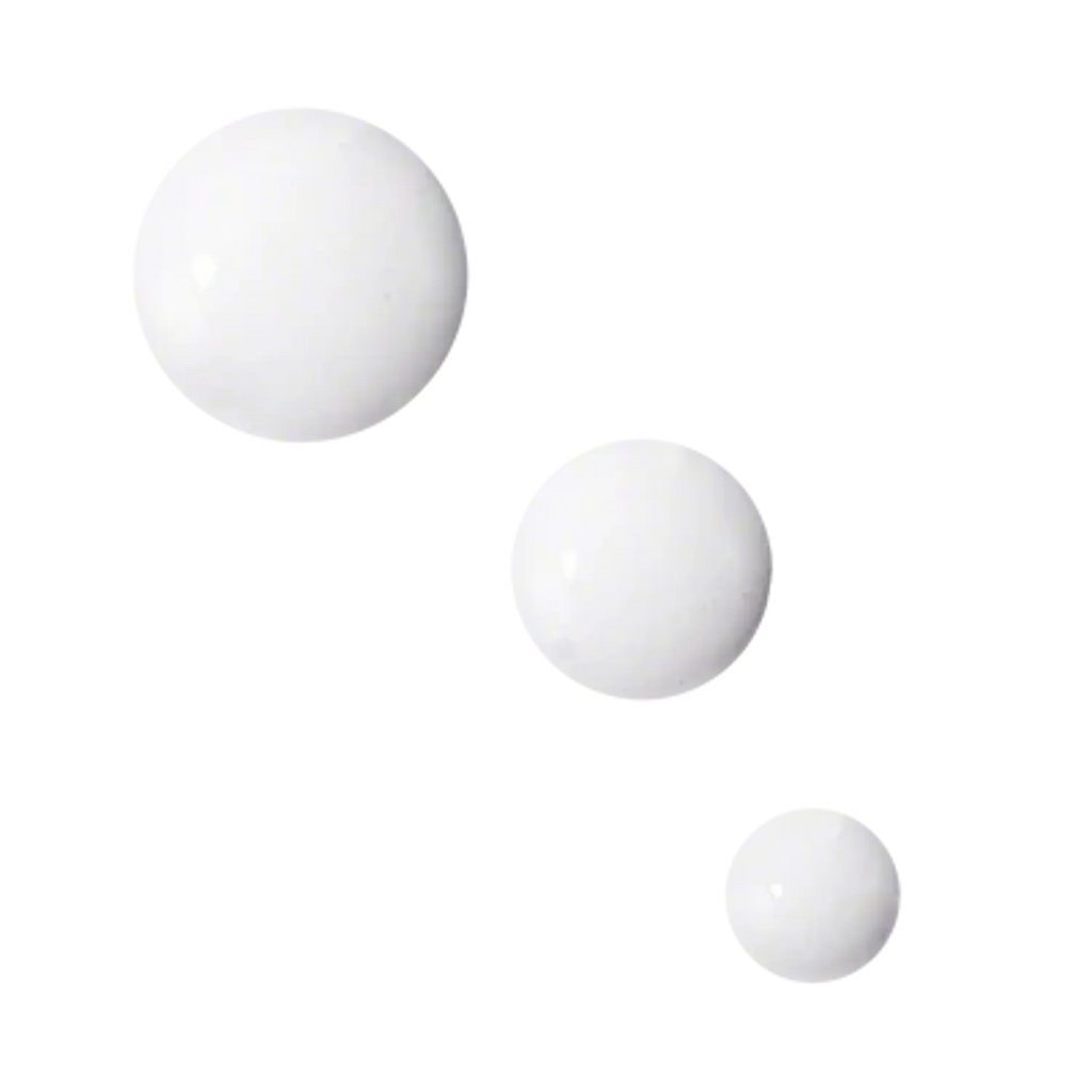 White cream texture swatches, three small dots