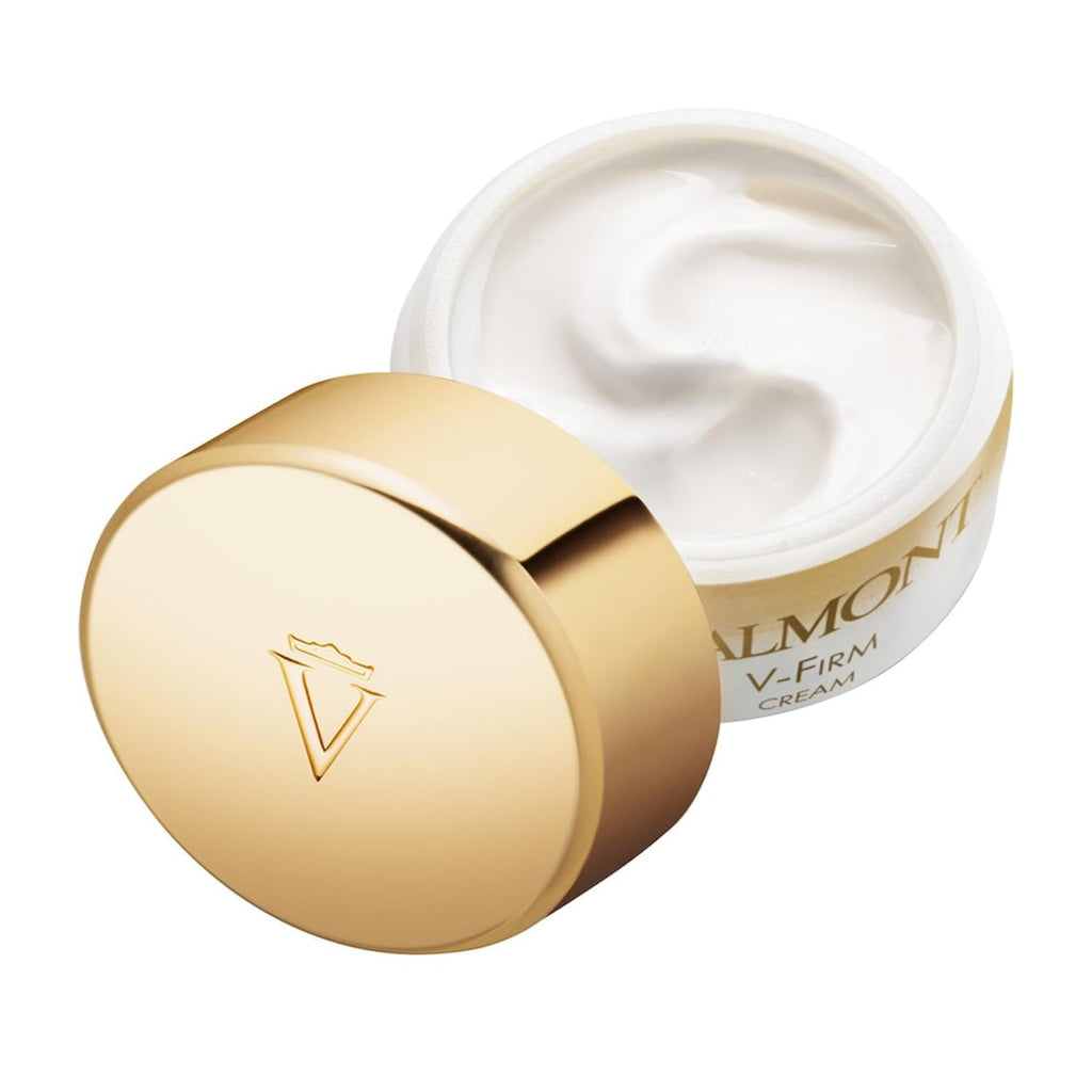 Valmont V-Firm cream jar with open lid and pale cream, gold cap