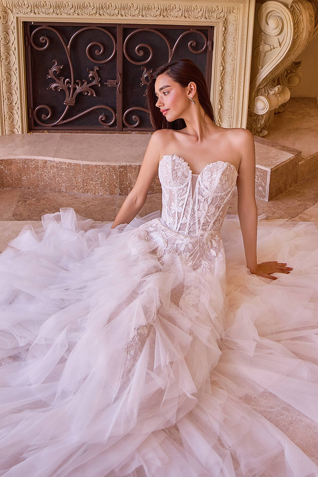 Strapless off-white wedding dress with sweetheart lace bodice and flowing layered skirt