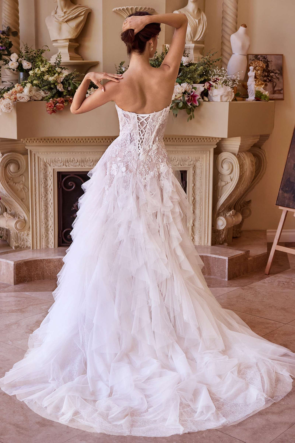 Strapless off-white wedding dress, corset back and layered tulle skirt with drop waist